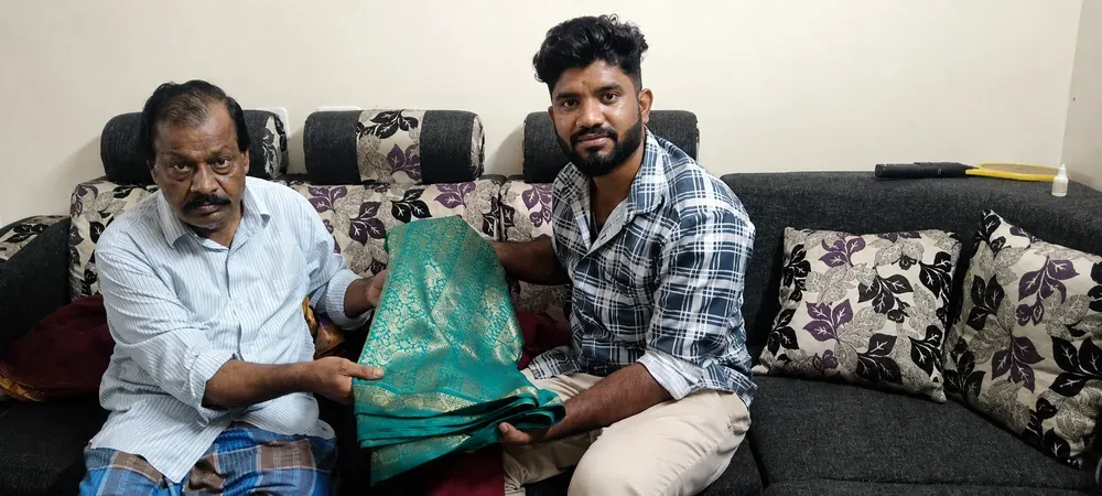 Our team collecting a teal silk saree from a customer on their sofa