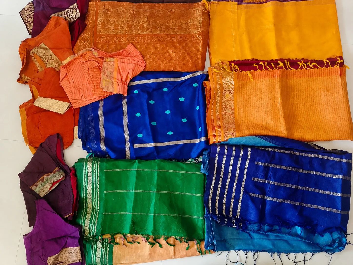 Old silk saree buyers near me — collection of used silk sarees and blouses ready for sale