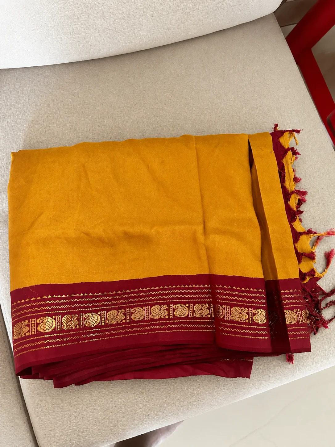 Old handloom silk saree buyers in Mylapore Chennai — mustard silk saree with peacock motif border
