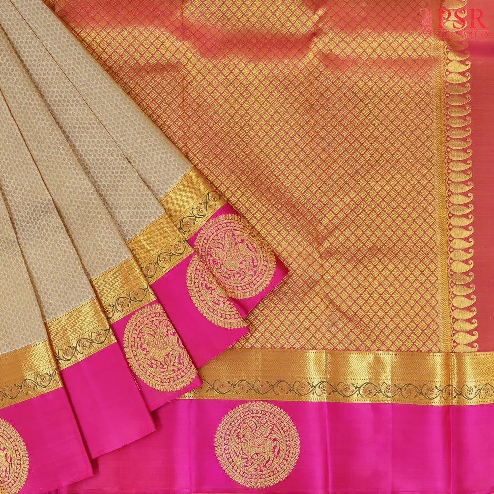 Close-up of a richly woven multicolour silk saree with gold zari border